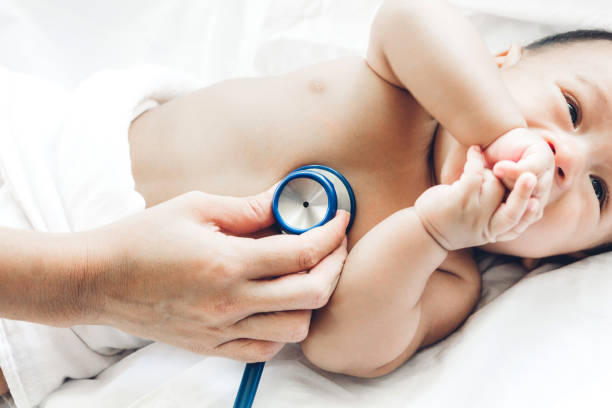 Doctor examining baby with stethoscope in the hospital.healthcare and medicine stock photo