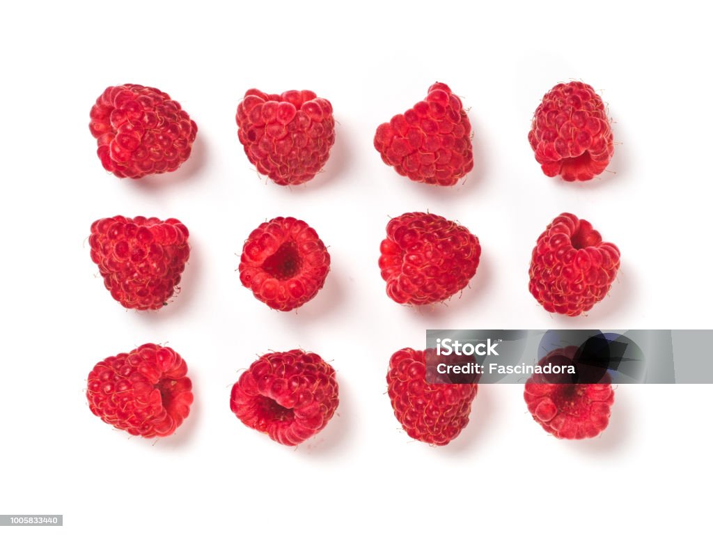 raspberries pattern isolated, creative layout View from above of ripe red raspberry on white background. Organic raspberries creative layout pattern, isolated on white with clipping path. Top view or flat lay. Vegan food concept Raspberry Stock Photo