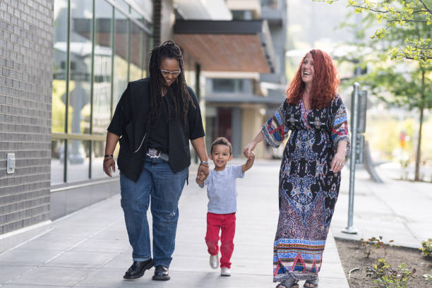 istock Female couple walking with their son 1005837066