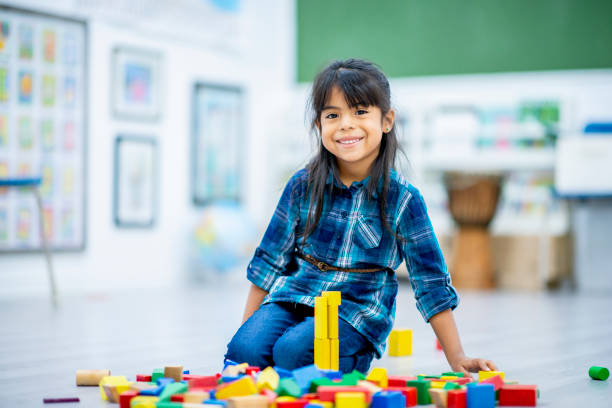 istock Girl Building A Tower 1005839562