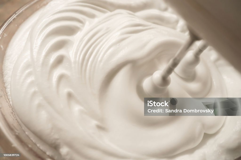 Beaten egg white with the blender Whipped Food Stock Photo