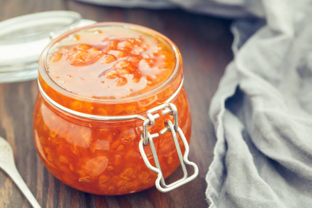 istock Glass jar with cloudberry jam. Nordic cuisine. 1005840084