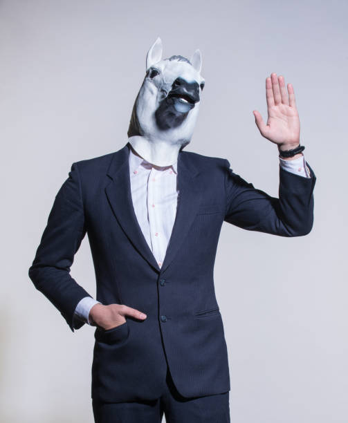 istock man with a horse mask on a light background 1005843296