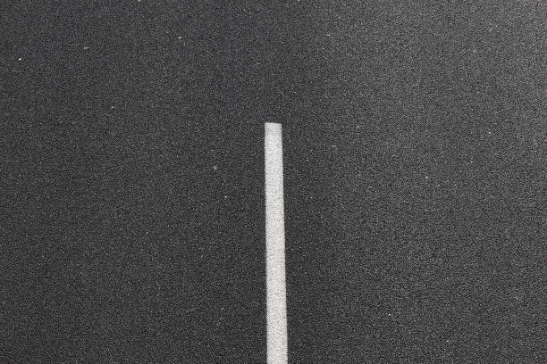 istock Asphalt road with white mark line. 1005846140
