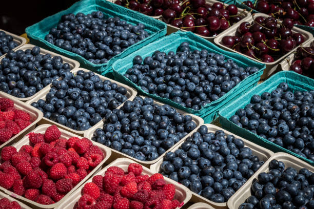 istock Several Containers Full of Fresh Blueberries, Raspberries and Cherries 1005850366