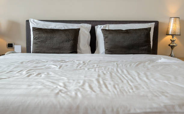 istock Bedroom modern style with pillows lamp 1005853394