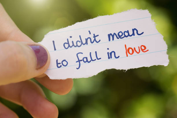istock Female hand holds little love note 1005853920