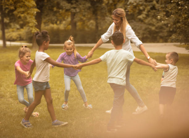 istock School children playing at nature. 1005854102