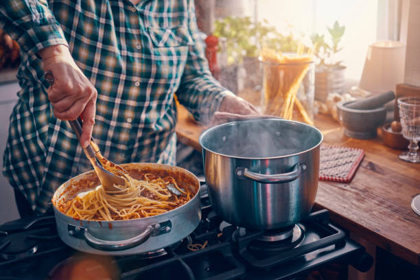 istock Preparing Homemade Spaghetti Bolognese 1005860580