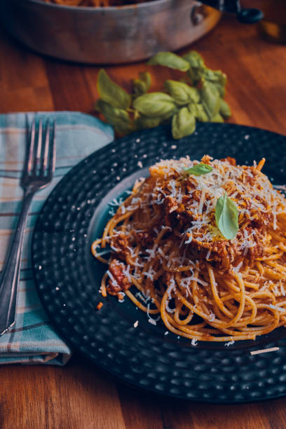 istock Eating Homemade Spaghetti Bolognese 1005860596