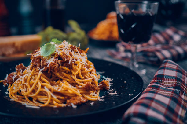 istock Eating Homemade Spaghetti Bolognese 1005860618