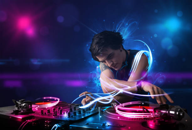 istock Disc jockey playing music with electro light effects and lights 1005867772