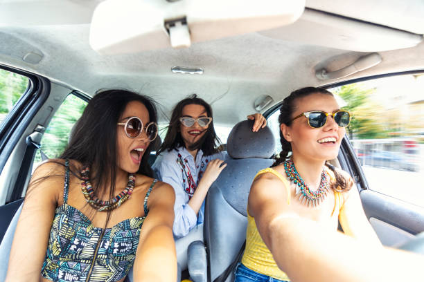 istock Selfie in car - happy three women 1005870290
