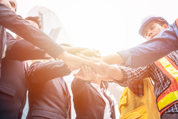 istock Group of business person with engineer are hands coordination for success the project 1005871486