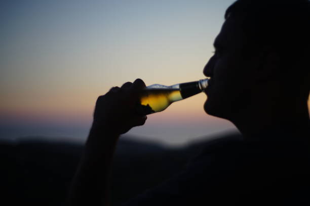 istock Having cool beer on a summer sunset at rooftop 1005873688