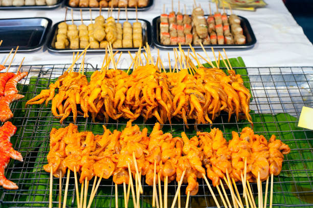 istock Grilled Squids on sticks, Phuket street market 1005874260