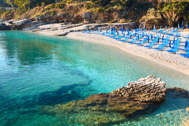 istock Beach chairs with umbrella. Beautiful  sea view. Corfu Island. 1005877690