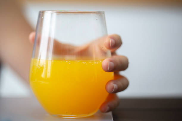fresh orange juice in glass stock photo