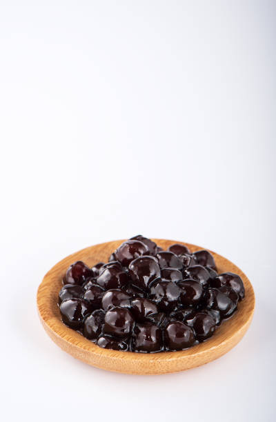 istock black pearls. Boiled tapioca pearls for bubble tea on white background. Copy space 1005882186