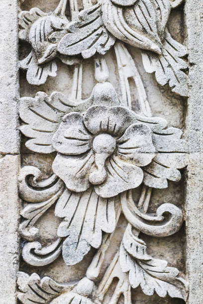 istock Traditional balinese stone carving, wall in temple 1005882510