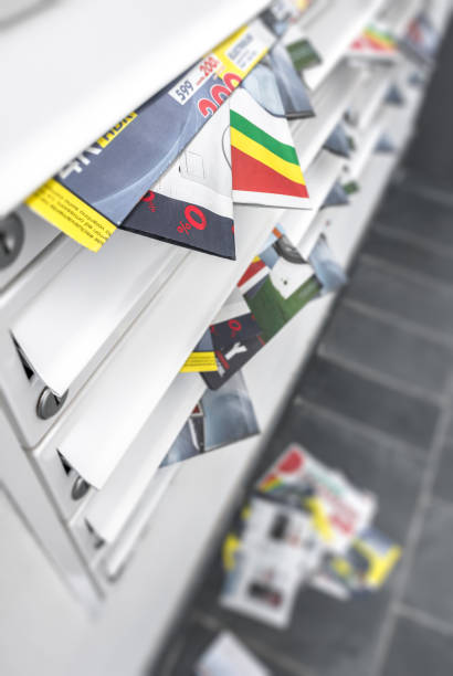 istock Modern metal mail boxes, overfull of leaflets 1005894328