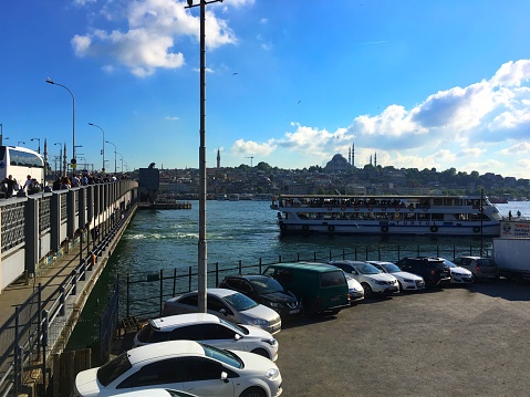 Istanbul, Turkey - May 23, 2017: Daily life and car parking area around Galata Bridge.