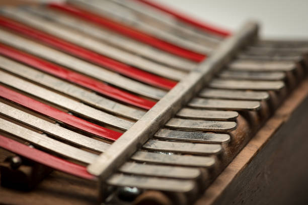 istock A thumb piano with silver and red tines 1005922732