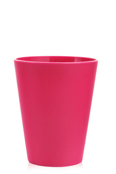 istock colored plastic glass for children's holiday on a white background isolated. 1005927122