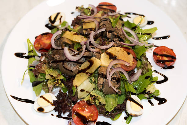istock Green salad with chicken liver 1005927232