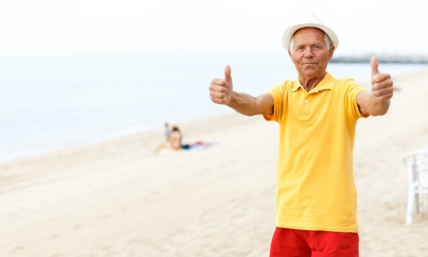 istock Satisfied active mature man giving thumbs up 1005927756