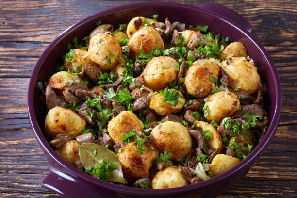 istock new Potatoes with Wild Mushrooms, close-up 1005928014