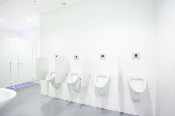 urinal and toilet doors urinals and toilet doors in an old building for men only door lever stock pictures, royalty-free photos & images