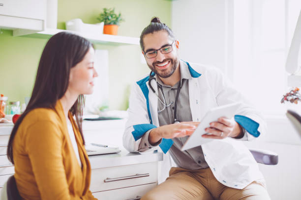 istock Doctor consulting his patient 1005932178