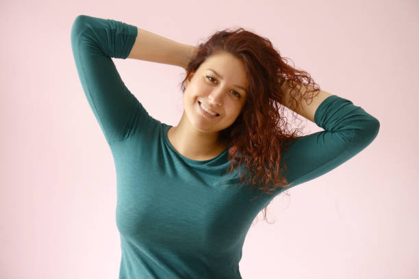 istock Beautiful girl on the pink background 1005934292
