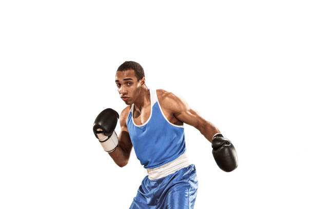 istock Sporty man during boxing exercise. Photo of boxer on white background 1005934310