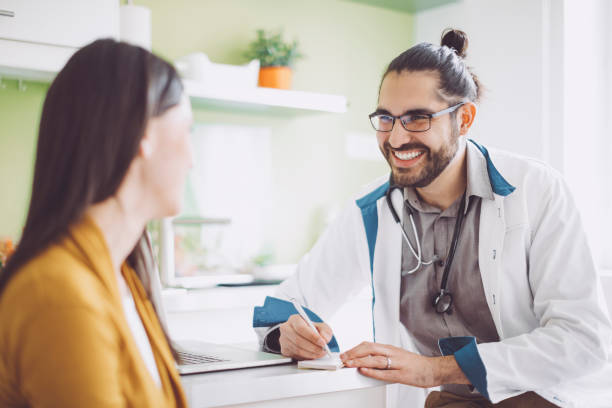 istock Doctor consulting his patient 1005934442