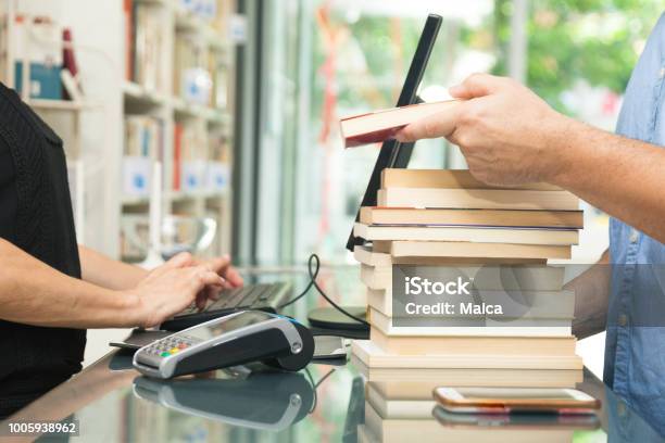 Customer Buying Books Stock Photo - Download Image Now - Book, Selling, Bookstore