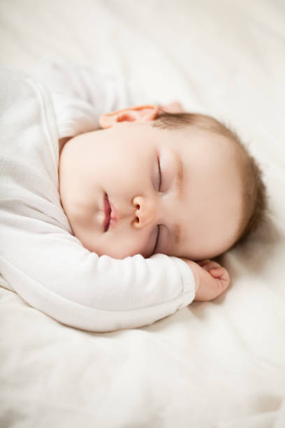 istock Little Baby Sleeping at Home (1 month old) 1005939186