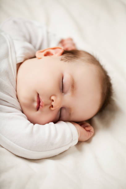 istock Sleeping newborn baby at home, bedtime 1005939188