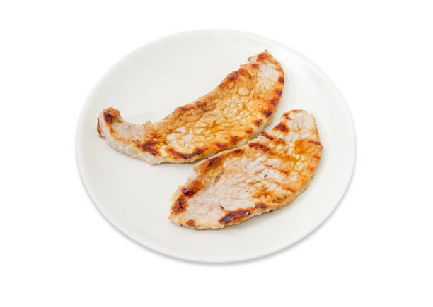istock Grilled sappy pork steaks on the white dish 1005941628