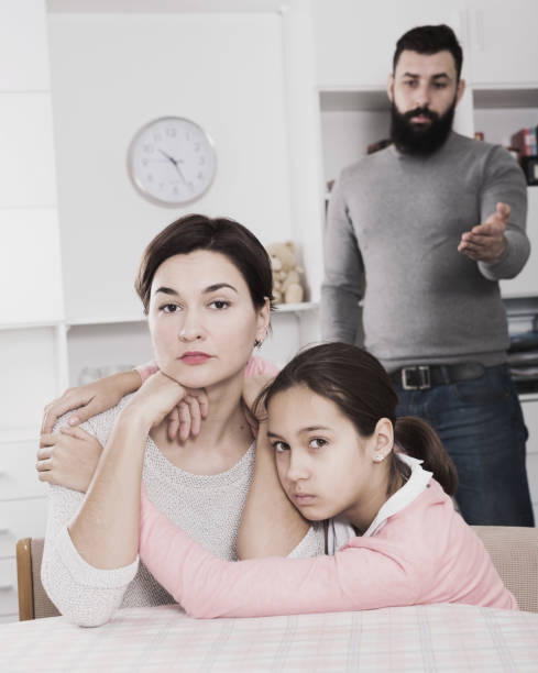 istock Father lecturing wife and daughter 1005942100