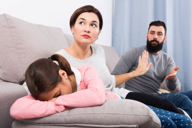 istock Father lecturing wife and daughter 1005942292