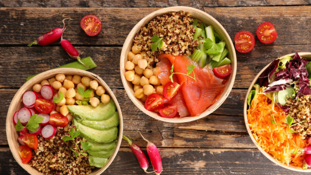istock vegetarian bowl on wood background 1005943582