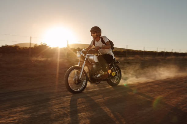 istock Man offroading on a vintage motorcycle 1005946172