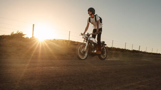 istock Man riding off-road on vintage bike 1005947024