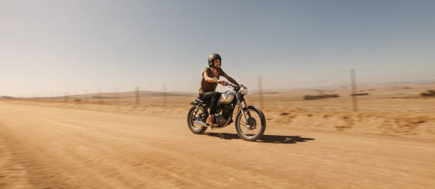 istock Rider driving motorcycle off-road 1005948470