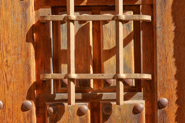 istock spyhole on textured spanish door 1005949350