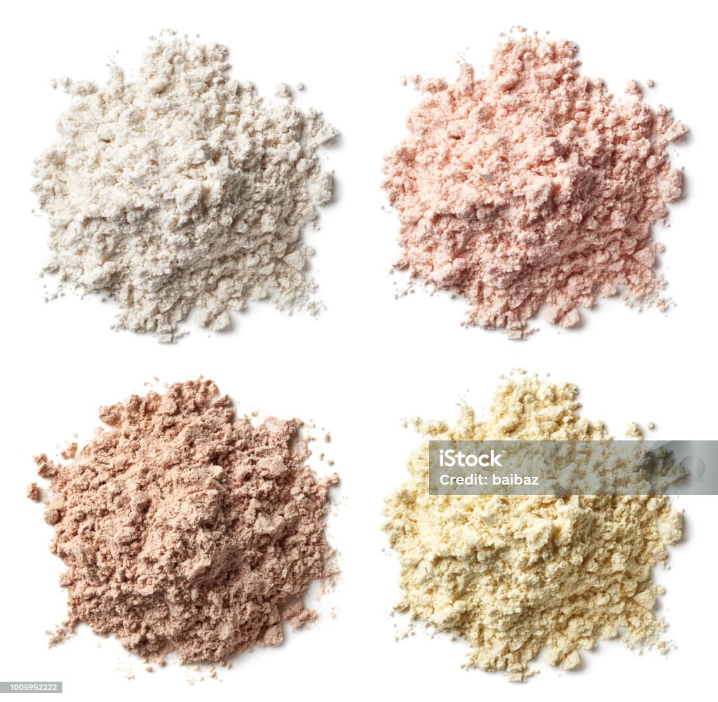 Four various heaps of protein powder (vanilla, strawberry, chocolate, banana) Four various heaps of protein powder (vanilla, strawberry, chocolate, banana) isolated on white background. Top view Ground - Culinary Stock Photo