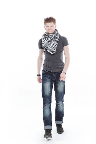 istock young man in a t-shirt and scarf ,confidently goes forward 1005956400