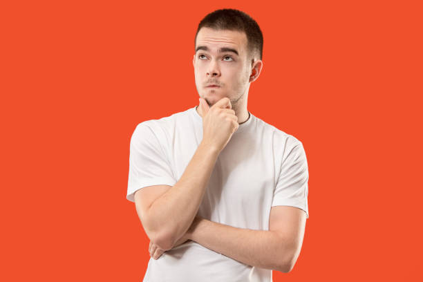 istock Young serious thoughtful businessman. Doubt concept 1005956464